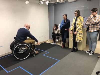Students learn from experience designer Ben Baker about accessibility in museums.