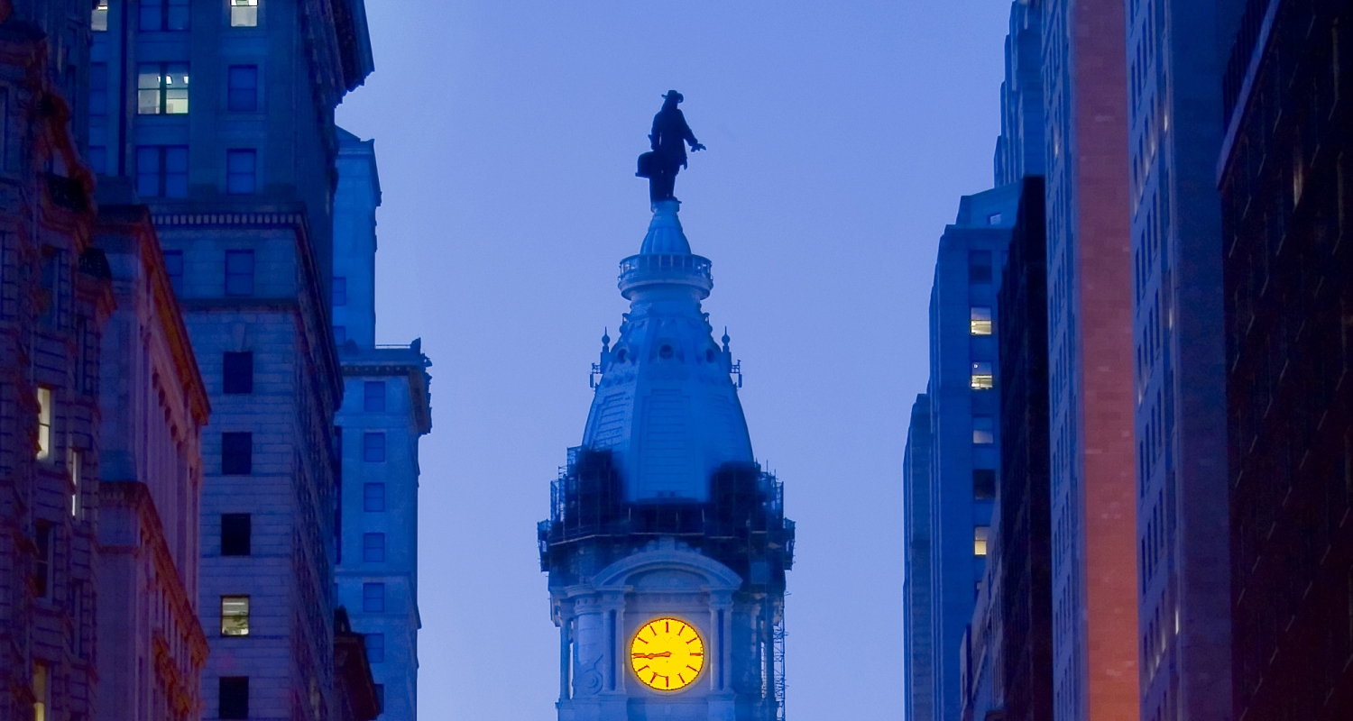 Penn on top of city hall with glowing clock