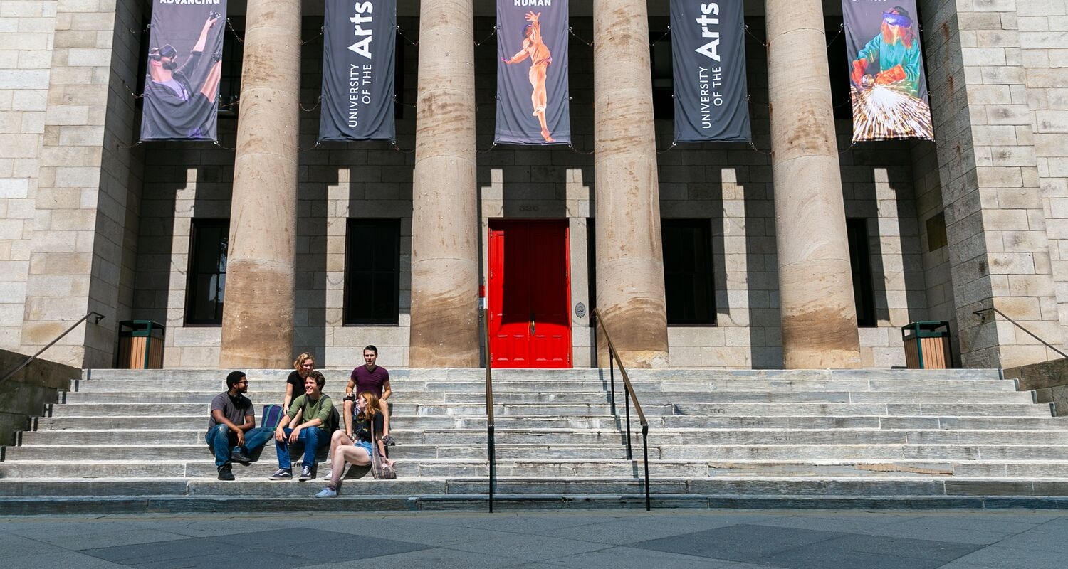 UArts students sit on the steps of Hamilton Hall