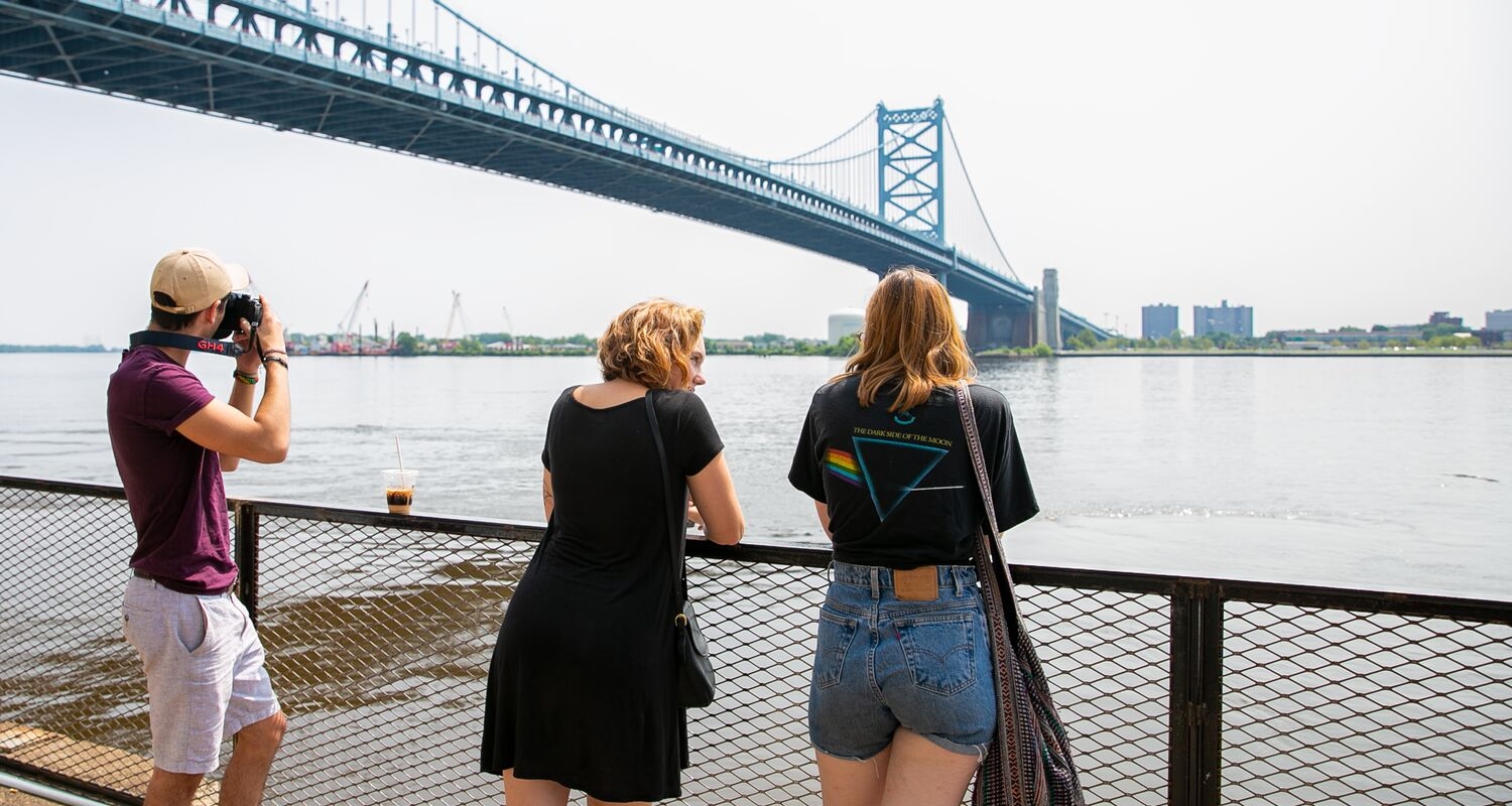 UArts students take photographs at Philadelphia's Ben Franklin bridge waterfront