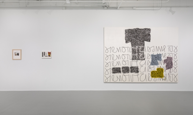 Installation view of Jonathan Lasker exhibition with large canvas with letter-like swirls and blocks of color to right; to the left a much smaller multicolored artwork