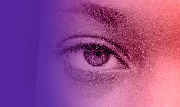 a close-up image of a person's right eye, with the top of their nose visible and a short, thin brow above their constricted pupil. the image has a gentle gradient from a deep violet to a pale red. 
