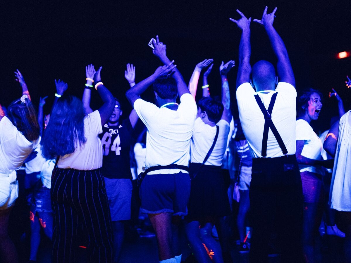 Students dance during the Glow Dance Party