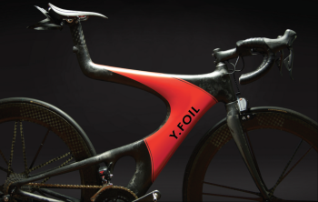 A sleek black bicycle with red detail that says Y foil