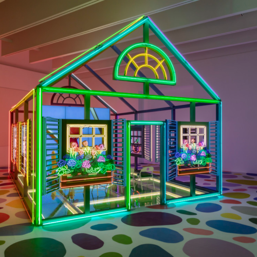 An art instillation of a house in neon colors by Alex Da Corte