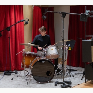 A drummer records during a recording session