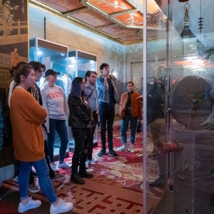 Students gather around an exhibit in the TCL Chinese Theatre during their trip to Los Angeles, CA.