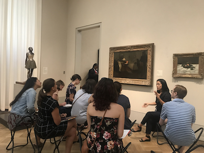 Students talk with a museum expert at the Baltimore Museum of Art.