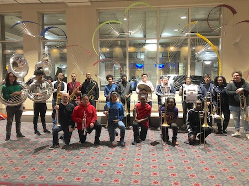 The CAPA Brass Band, a New Orleans style performance group, poses for a picture.