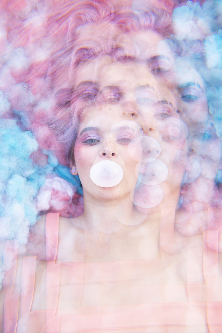 An image of a female blowing a bubble with bubble gum is superimposed many times.