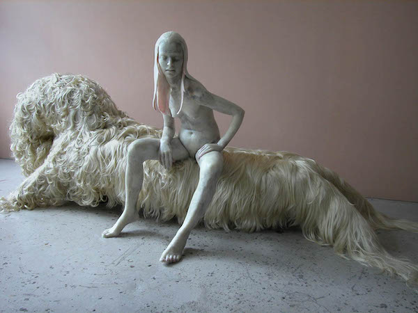 "Beauty is only a promise of happiness" Stendhal, microcrystalline wax, synthetic human hair, plywood, 4' x 4' x 8', 2009