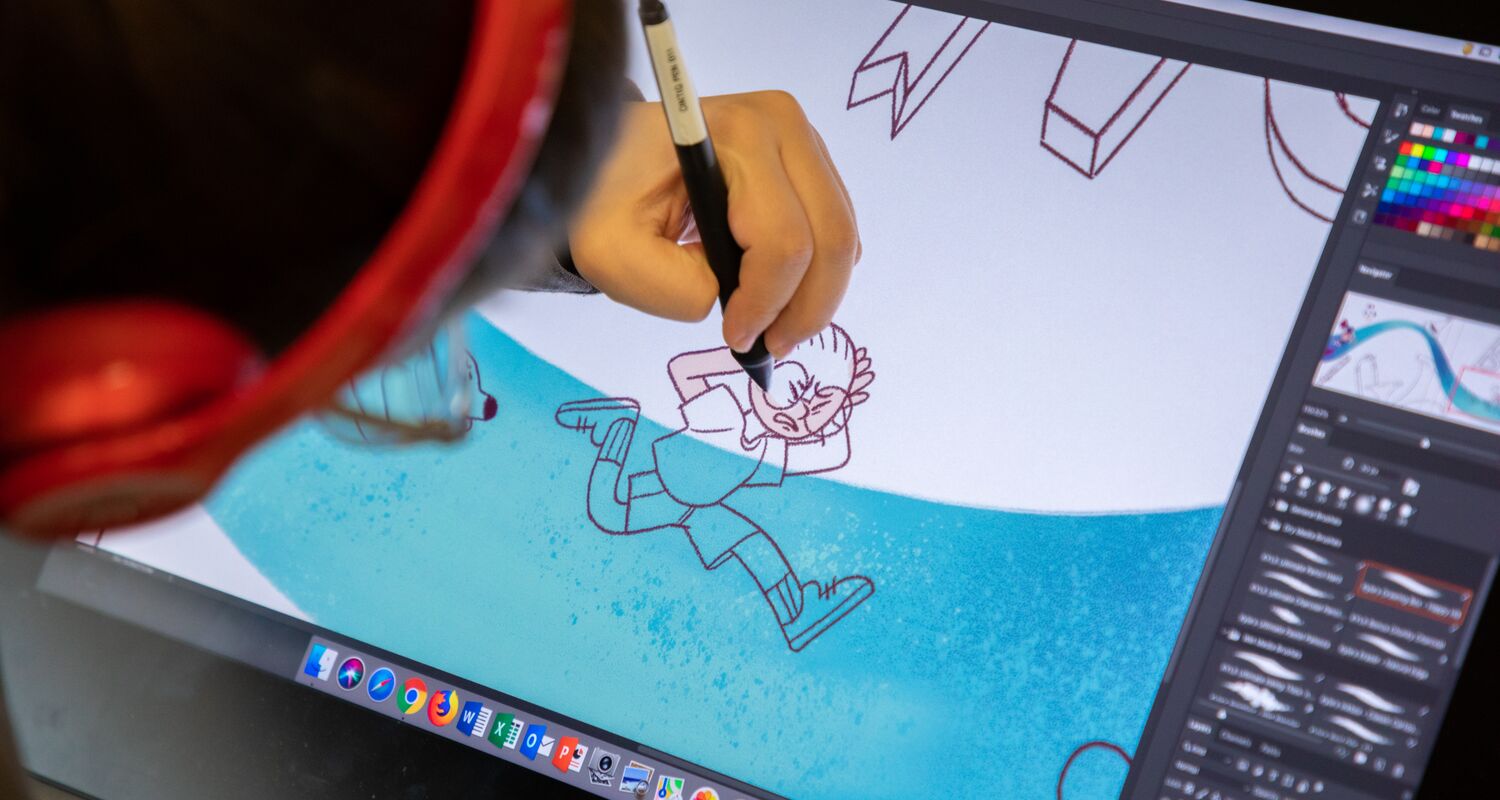 A student works on their digital illustration.