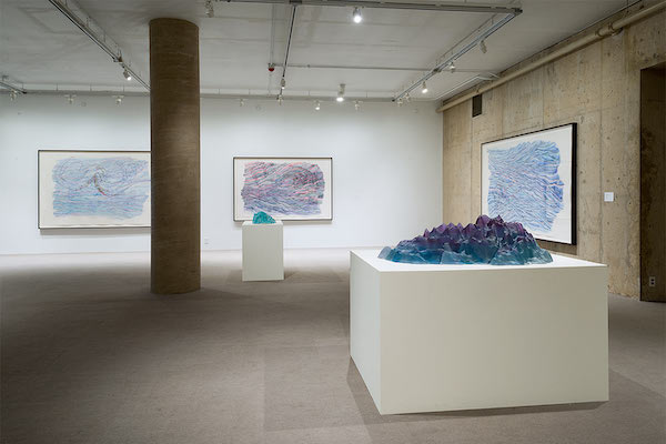 left to right: Morning Octopus (watercolor), Moving Octopus in a Purple Sea (watercolor), Moving Octopus in a Purple Sea, (sculpture), Red Edge in Shallow Water (watercolor)