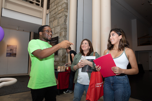 New students check in with a First Year Guide at Orientation.