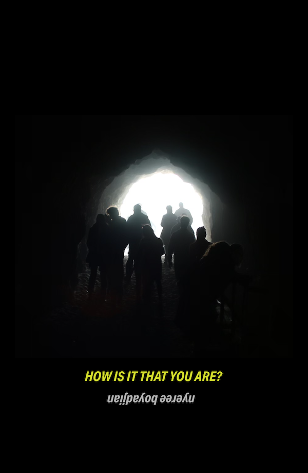 An image of people in a tunnel walking towards the light