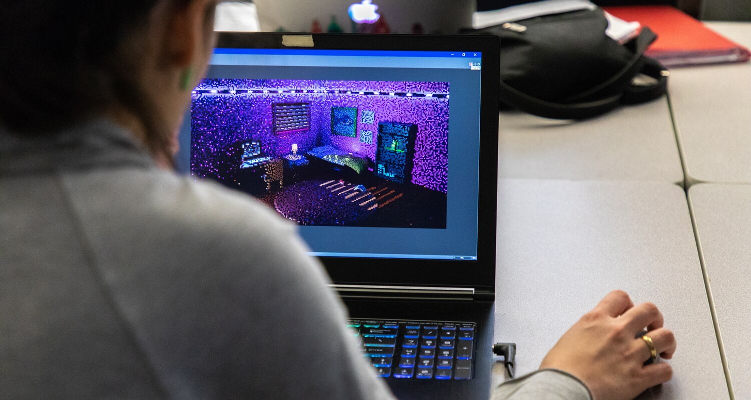 UArts student creates purple digital are on a laptop