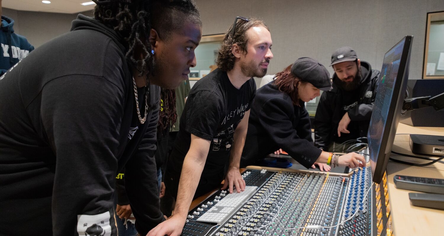 UArts Music, Business, Entrepreneurship and Technology students mix audio over a modern soundboard