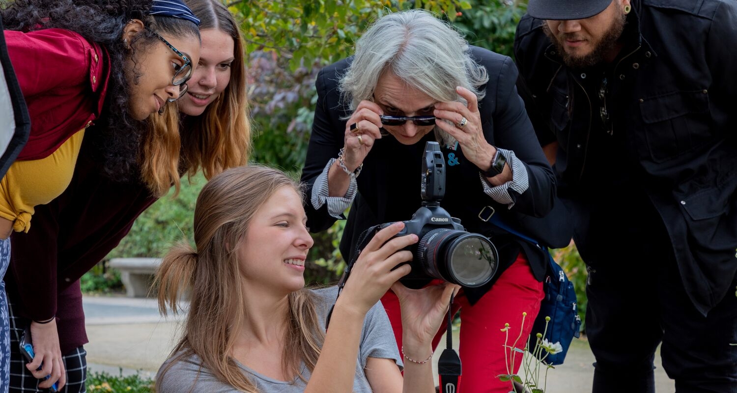 UArts students work on a photography project with faculty member Barbara Proud