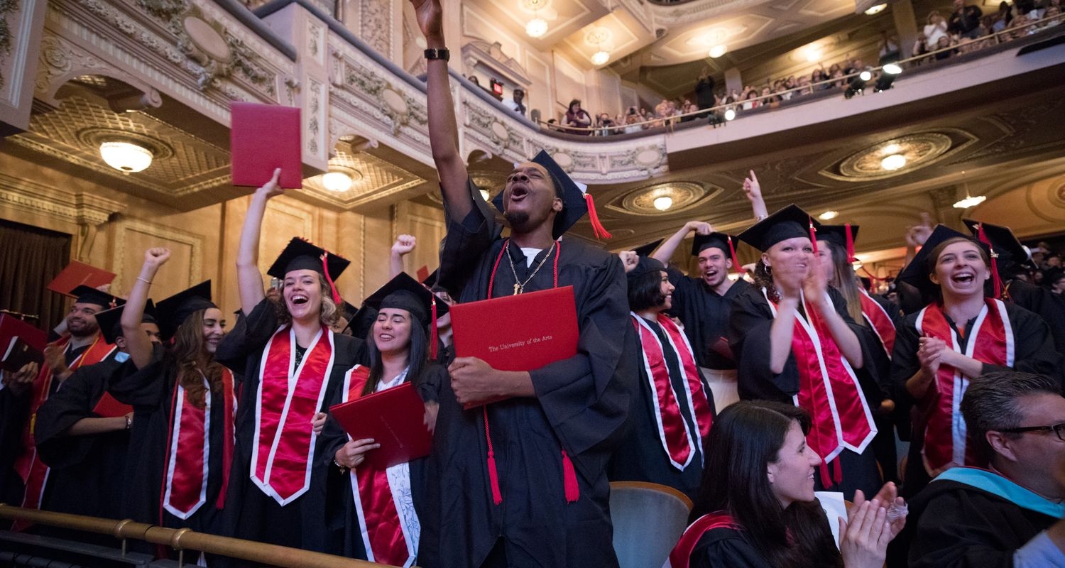 UArts students cheer in cap and gown at Commencement