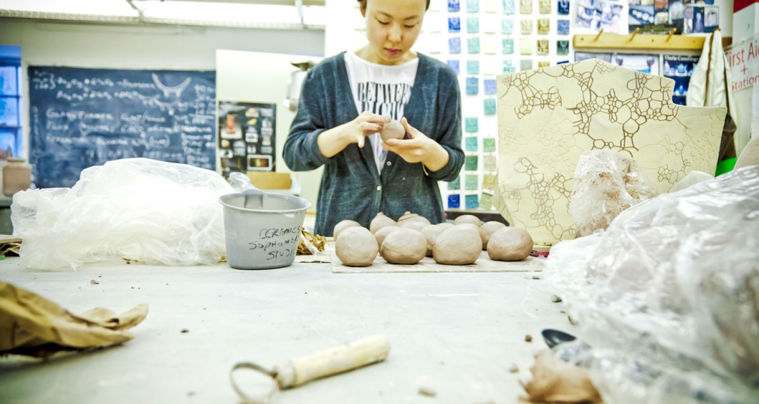 ceramic student at work for program page