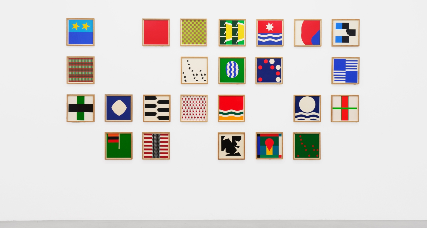 series of multicolored square artworks by Samson Kambalu framed and arranged on a white wall