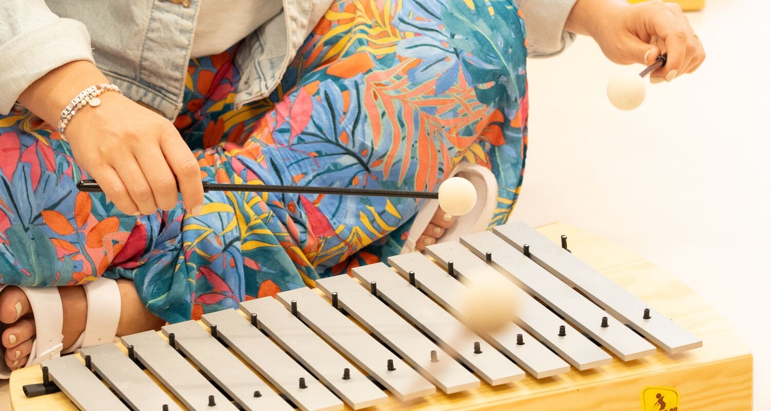 student playing xylophone