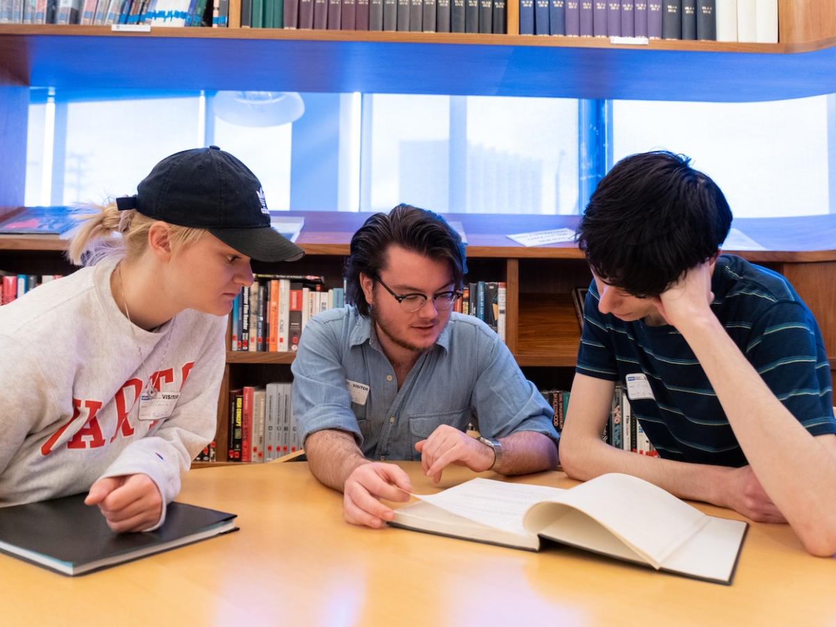 Three students read a script together in the Writers Guild of America West during their trip to Los Angeles, CA.