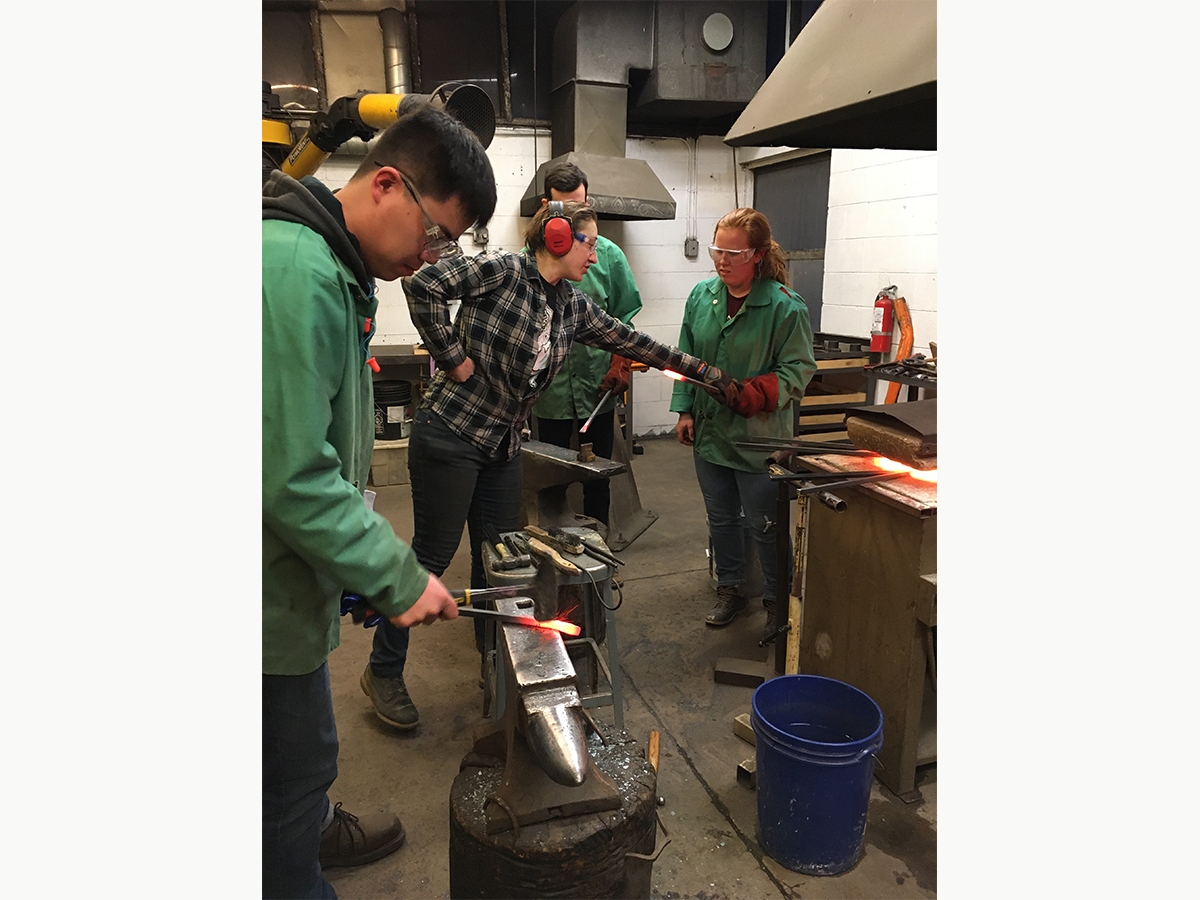 Students and faculty hammer fired metal