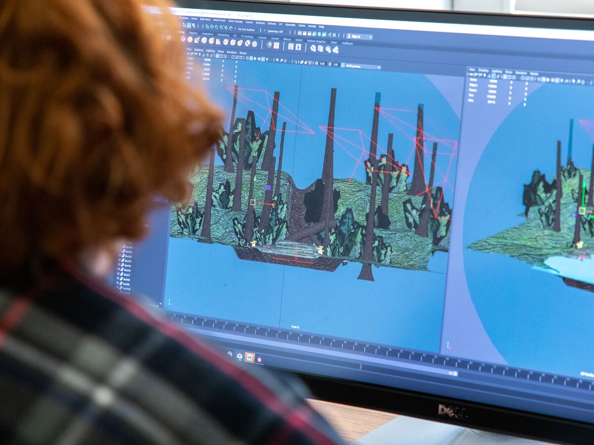 A student uses a computer to create an animation project in the Game Art program.