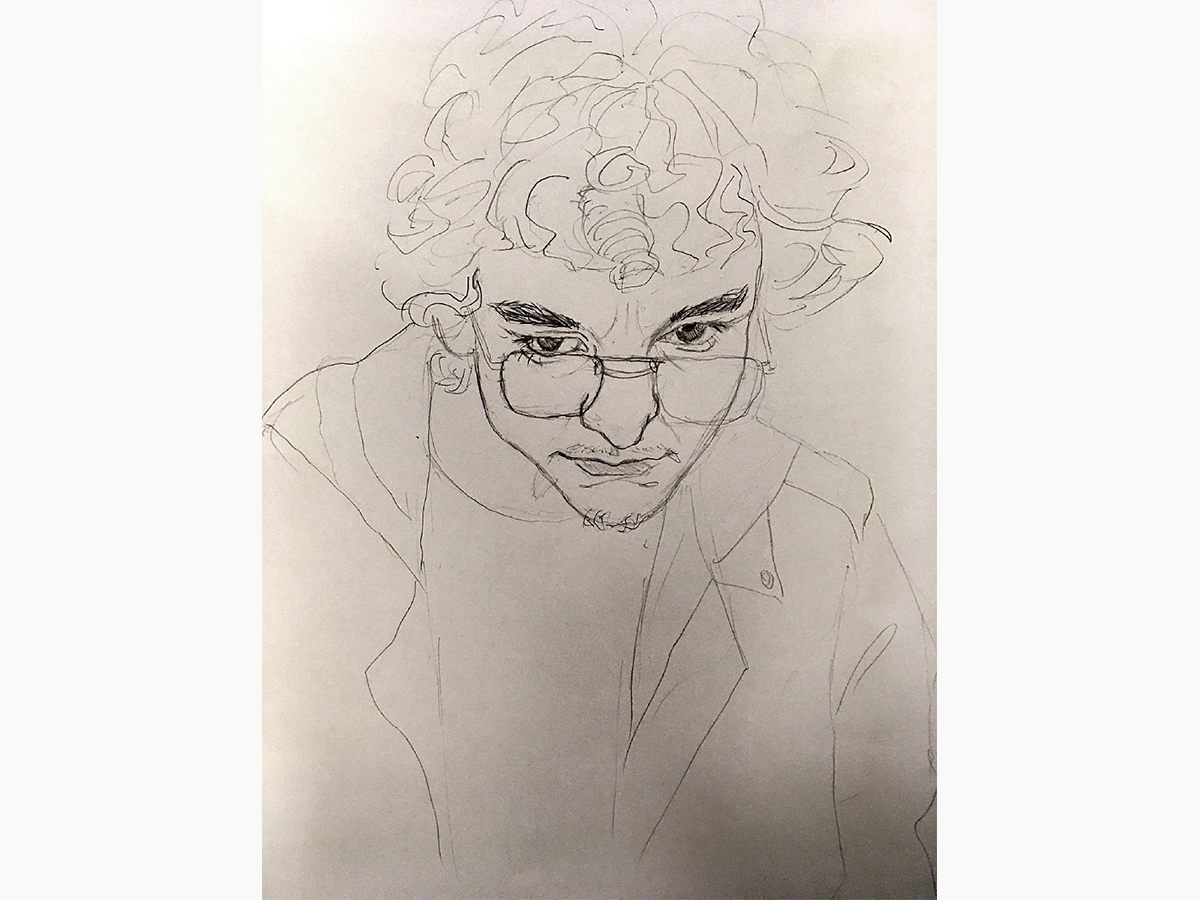 Jack Geissler '23, a quick portrait of a person with curly hair and glasses