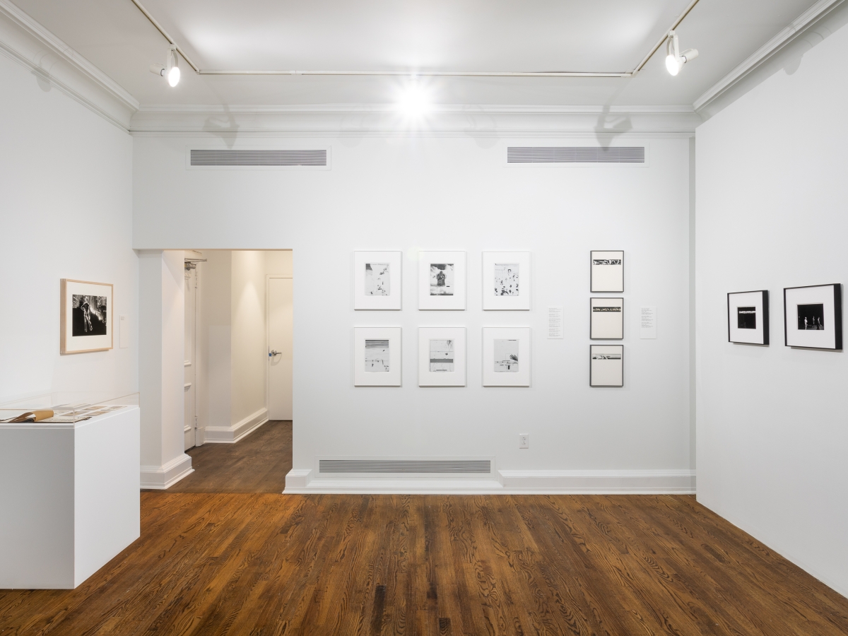 Invisible City Exhibition, Gallery C: group of 6 photographs on far wall next to a column of three photographs; a single photograph is on side wall above a display on a pedestal