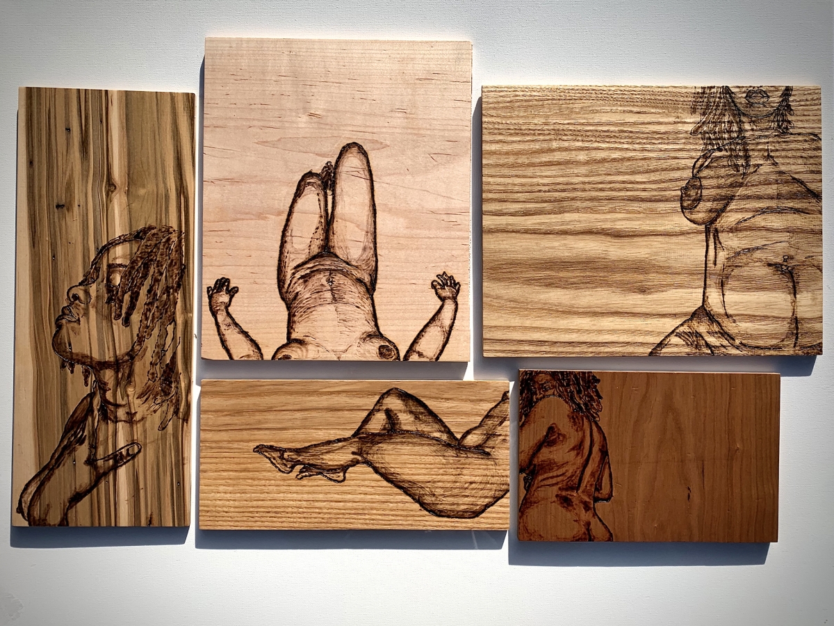 Wooden boxes with etches of nude women