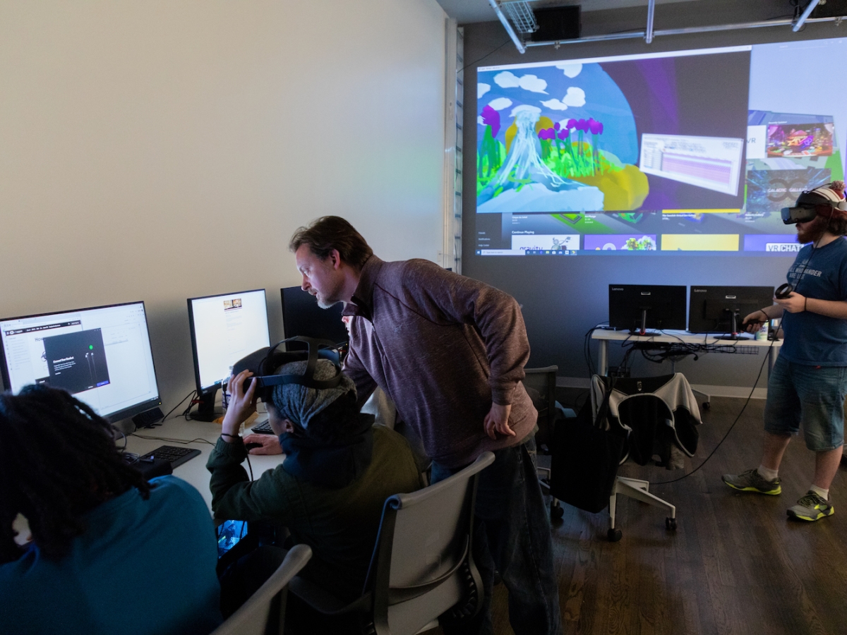 Erik Van Horn teaches students how to make art using virtual reality technology in the Center for Immersive Media