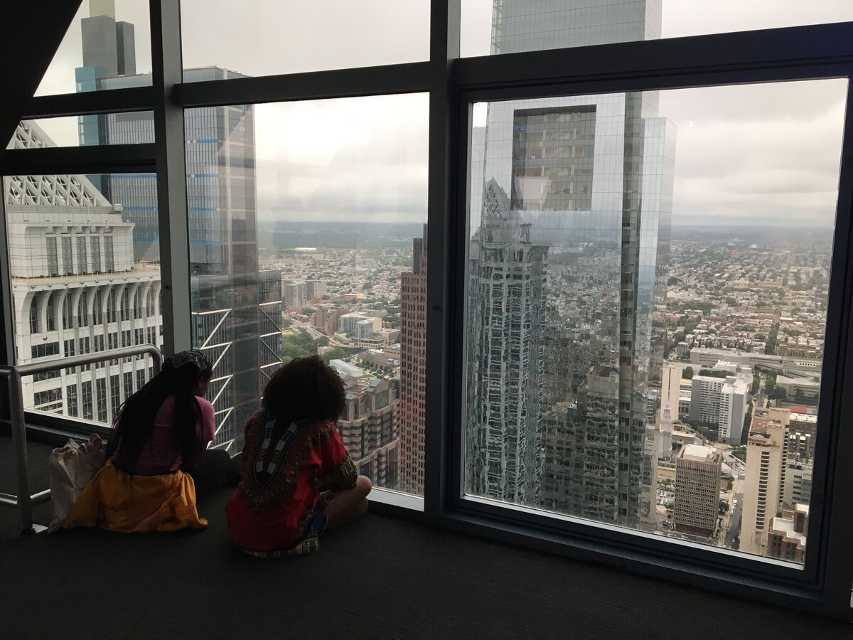 Students look out their window to see the city skyline