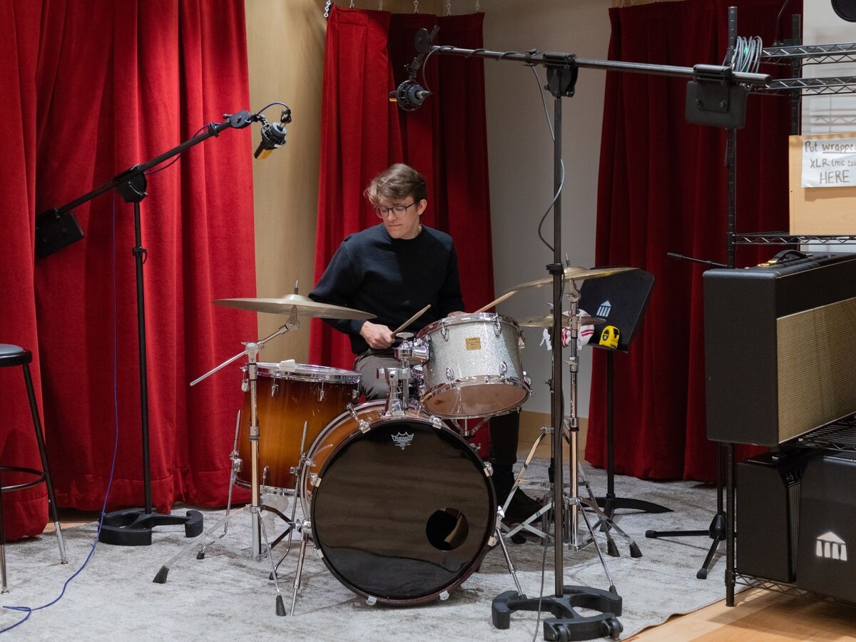 A drummer records in the studio