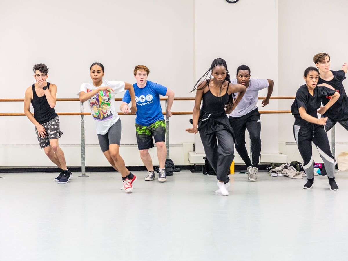 Dancers practice their choreography in the studio