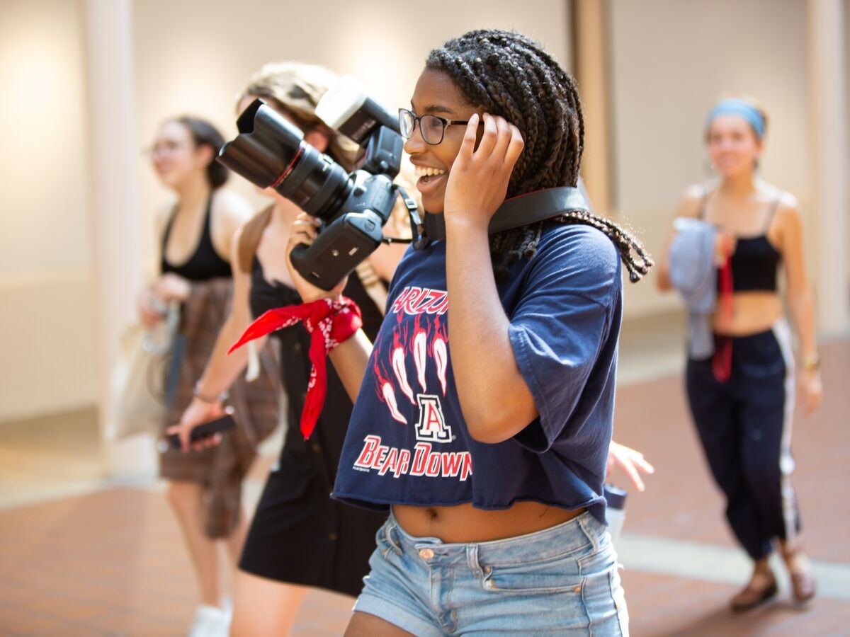 Students take pictures around campus with a DSLR camera