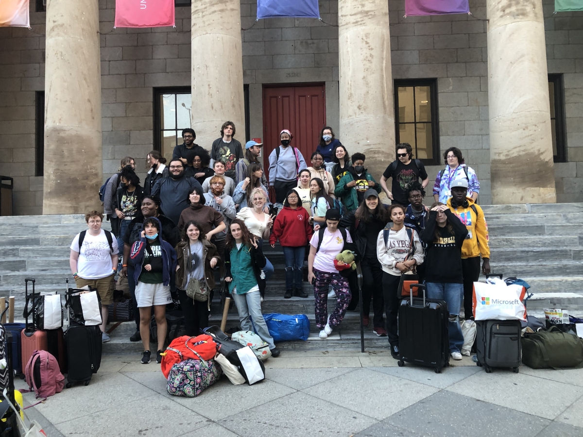 animation students gather on the steps of Hamilton Hall with suitcases before embarking to Canada 
