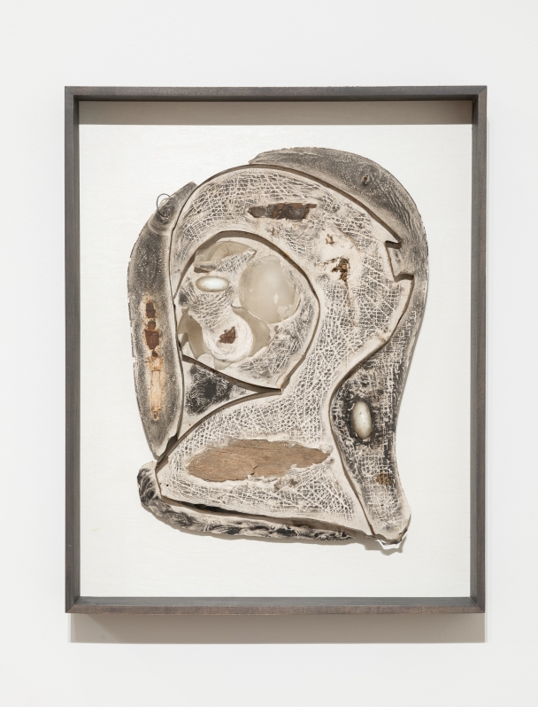 a framed work made in a neutral palette featuring organic biomorphic shapes against a white background.