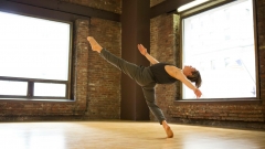 Student dances and practices in a studio