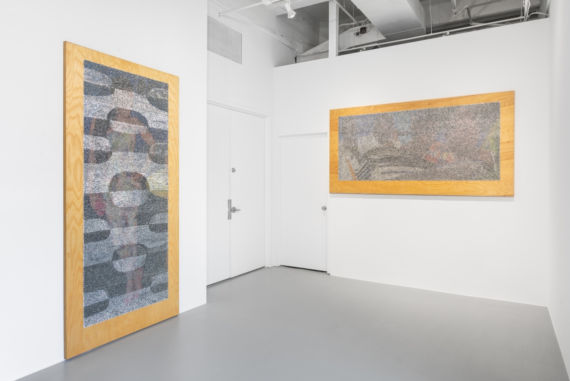 Installation image of two large works hanging caddy-corner from one another