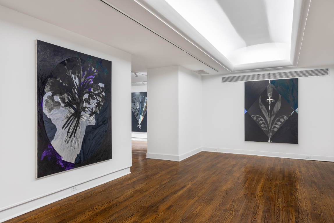 Installation view of three paintings on three different walls in a palette of dark blues, purples, silver and black