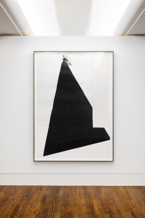 Image of a graphite and collage work with a small woman at the top and a dark black angled skirt filling the rest of the work