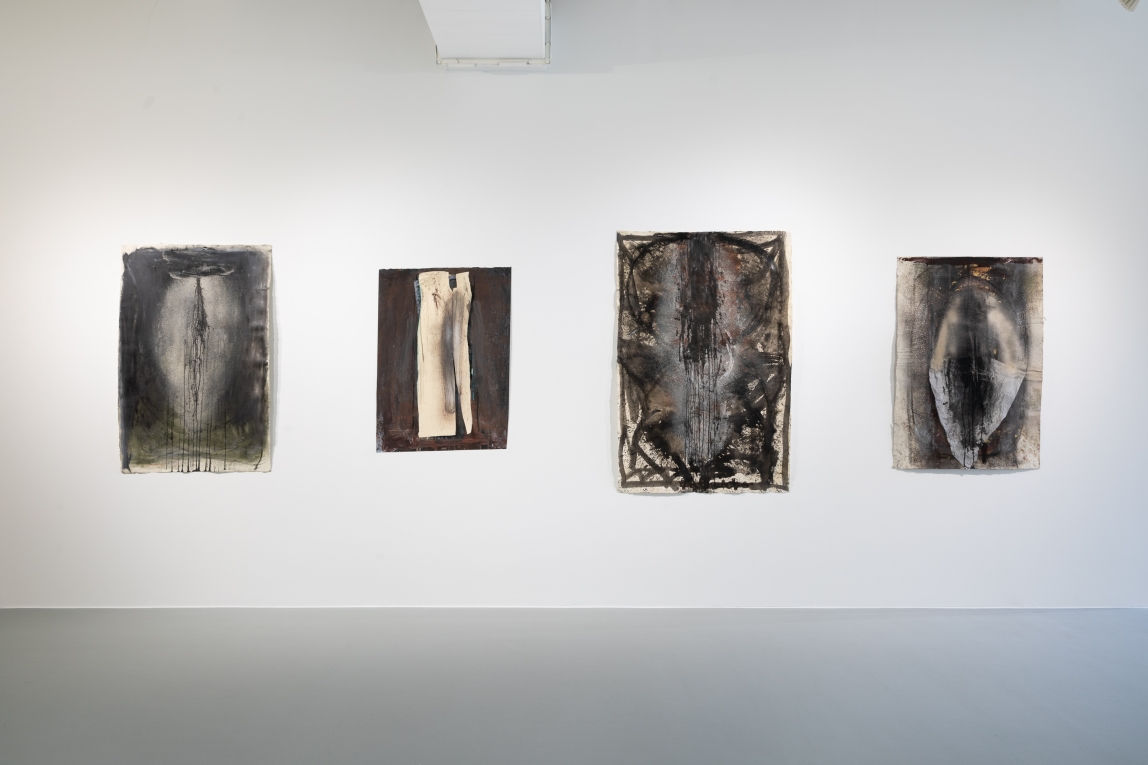 Installation view of four drawings in a row on gallery wall