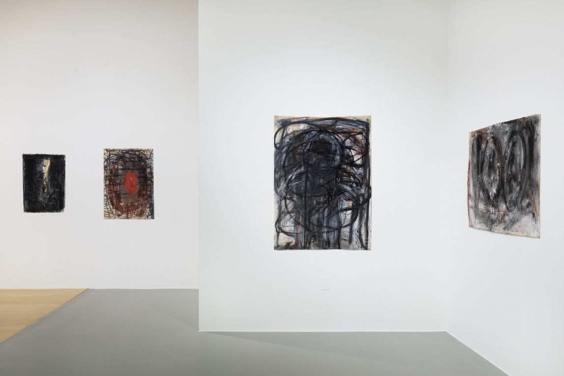 Installation view of four different drawings across three different planes/gallery walls
