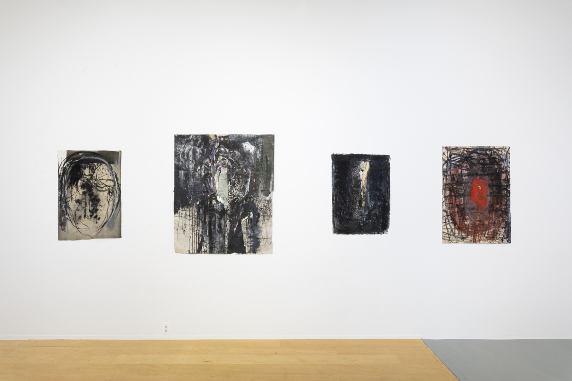 Installation view of four drawings across a wall