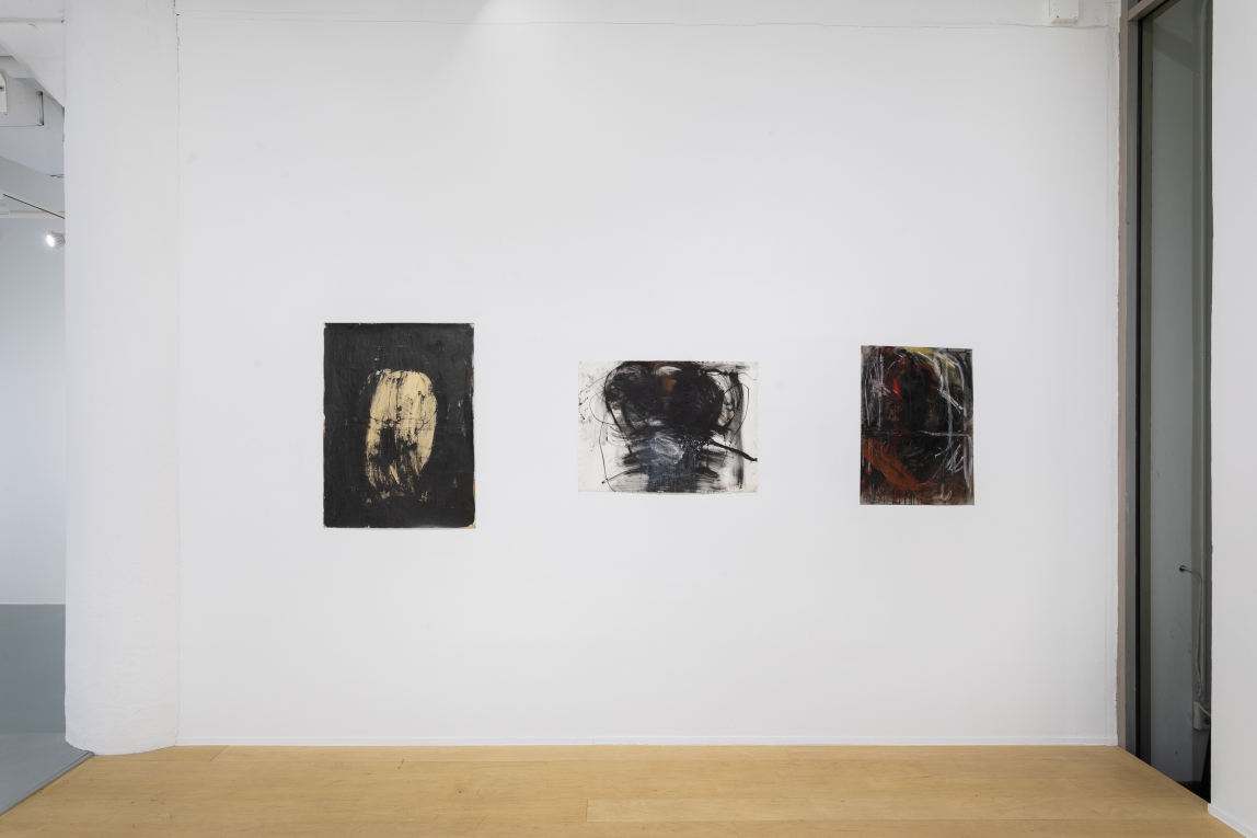 Installation view of three drawings in a row on a wall