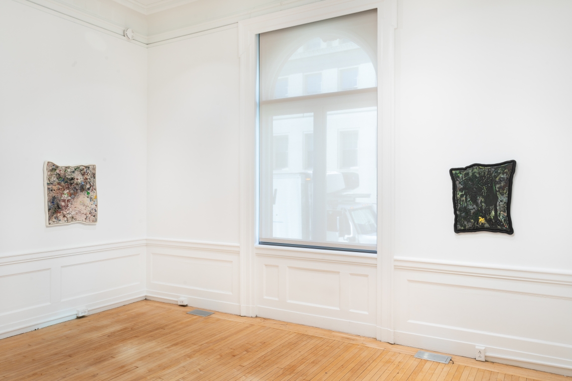 Installation view of two framed paintings on adjoining walls