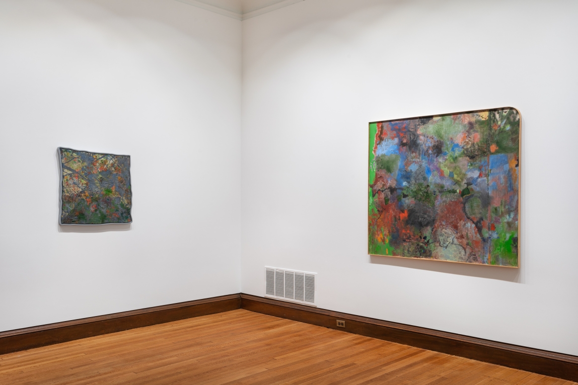 Installation view of two paintings displayed on adjoining walls