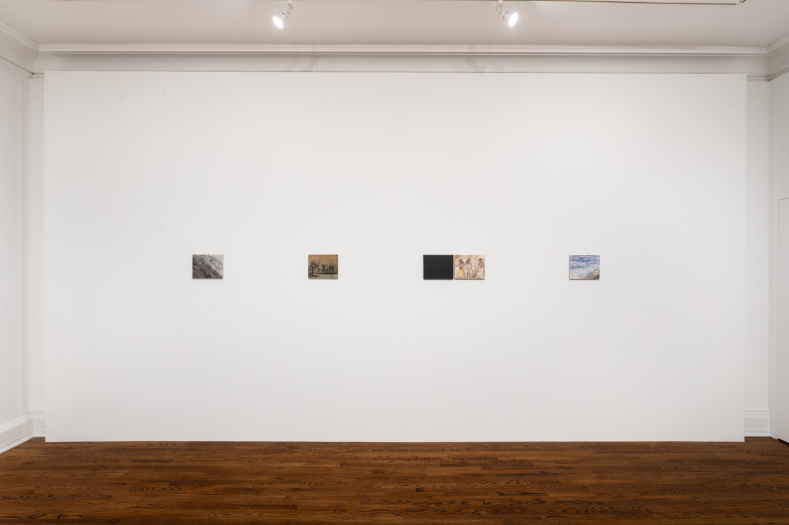 Installation view of four small works displayed in a line on a wall